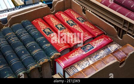 Old books for sale at Saint Paul flea market on April 6, 2013 in Paris, France Stock Photo