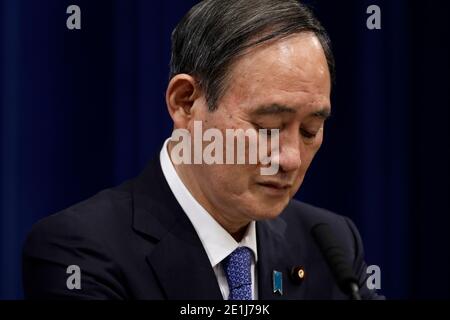 (210107) -- TOKYO, Jan. 7, 2021 (Xinhua) -- Japanese Prime Minister Yoshihide Suga attends a news conference at the Prime Minister's Official Residence in Tokyo, Japan, on Jan. 7, 2021.  Japanese Prime Minister Yoshihide Suga declared a state of emergency in the Tokyo metropolitan area including Tokyo, Saitama, Chiba and Kanagawa prefectures on Thursday, authorizing tougher measures to fight a resurgence in COVID-19 infections.   The state of emergency will be effective from Friday to Feb. 7, with measures including urging people to stay at home and calling for restaurants and bars to stop ser Stock Photo