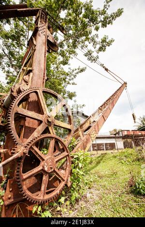 Wreck and rusty mining excavator in old abandoned tin mine in Takua Pa, Phang Nga, Thailand. Stock Photo