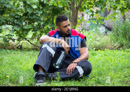 drunk young worker Stock Photo