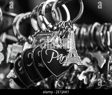 PARIS - APRIL 6:  Eiffel tower keychain with heart and Arch de Triumph for sale on April 6, 2013 in Paris, France. Eiffel tower trinket is one of the Stock Photo