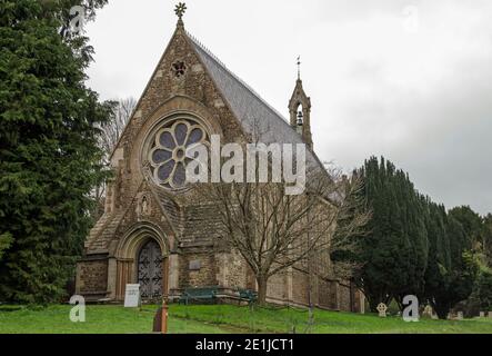 View of the West entrance to the historic Church of Saint Mary in the pretty village of Itchen Stoke in Hampshire on a cloudy autumn day. The church i Stock Photo