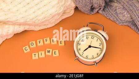 Coffee time concept with retro old vintage alarm clock and muted faded background, banner about the time. High quality photo Stock Photo