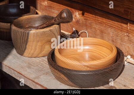 Tableware made of natural wood. Wooden plates. Reusable tableware without the use of plastic. Stock Photo