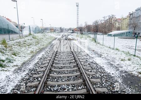 Prague, Czech Republic. 01-07-2021. Empty railways on Praha Dejvice train station close toHradcanska station in Prague 6 while snowing Stock Photo