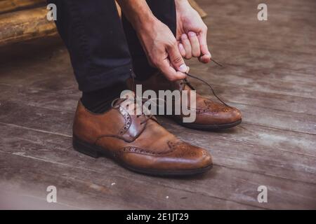 a groom and brown wedding shoes Stock Photo