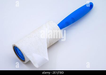 roller for cleaning clothes from wool, pet hair on clothes, Roller cleans clothes Stock Photo