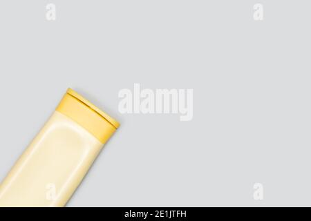 A bottle of shampoo on a gray background with copy space Stock Photo