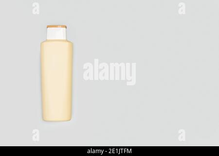 A bottle of shampoo on a gray background with copy space Stock Photo
