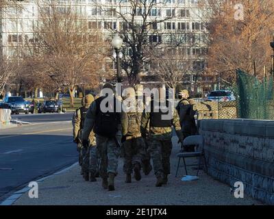 Washington, District of Columbia, USA. 7th Jan, 2021. As the sun rose on the U.S. Capitol, members of the National Guard march to their assembly point. Credit: Sue Dorfman/ZUMA Wire/Alamy Live News