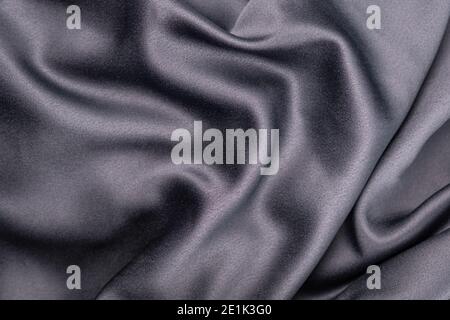 wavy rippled gray blue purple silk satin fabric background Stock Photo