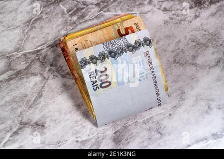 bundle of Brazilian money with the two hundred reais bill. Stock Photo