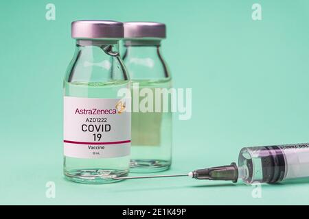 Izmir, Turkey - November 18 2020: Coronavirus vaccine concept and background. New vaccine AstraZeneca isolated on green background. Covid-19, 2019-nCo Stock Photo