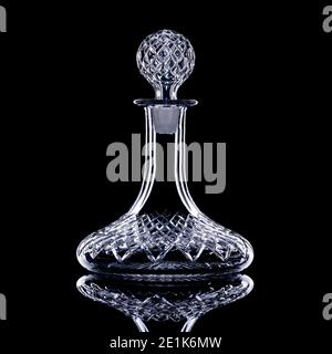 Empty ship's decanter on black background Stock Photo
