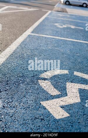 Floor signal that indicate priority parking for vehicles of people with disabilities. Selective focus Stock Photo
