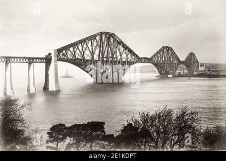 19th century vintage photograph: view of the railway bridge over the Firth of Forth, Scotland, seen from the south bank of the river. c.1890's. Stock Photo