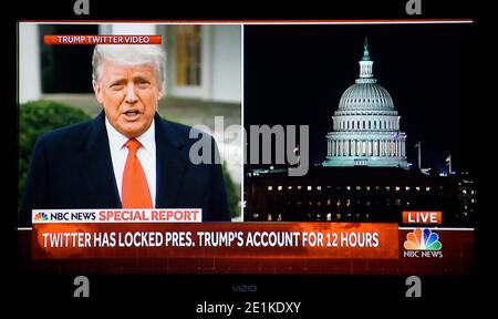 An NBC TV split screenshot of a Donald Trump video and the U.S. Capitol after it was stormed by pro-Trump demonstratiors on Jan. 6, 2020. Stock Photo