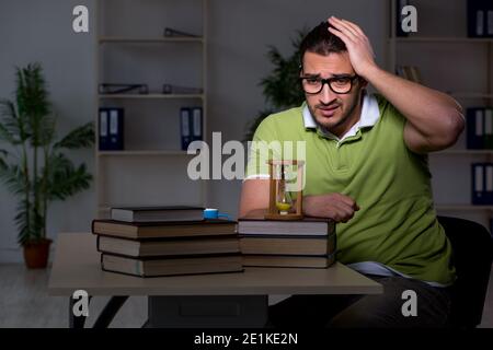 Young student studying at night at the home Stock Photo