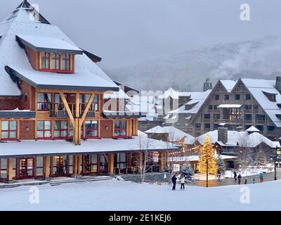 Stowe Mountain resort Spruce peak village at evening time early December 2020 Vermont, USA Stock Photo