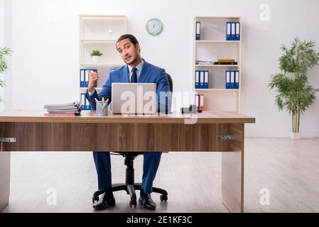 Young businessman employee working in the office Stock Photo