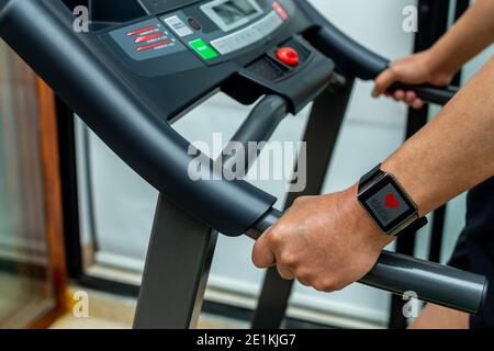 Close up of smartwatch of a person in treadmill Stock Photo