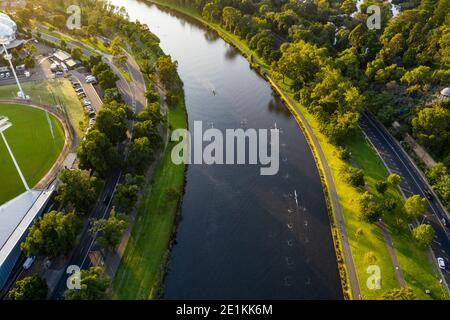 Aerial view of rowing teams on the Yarra Rive at sunrise in Melbourne, Australia Stock Photo