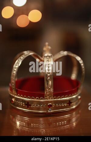Church attributes for wedding ceremony. Gold crown on the altar. Wedding concept Stock Photo