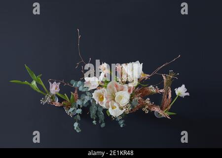 Flowers composition on a black background. Wedding white decor. Festive decor. Bouquet from spring flowers. Wedding bouquet Stock Photo