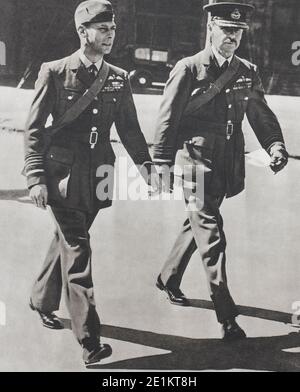 The king of England, in RAF uniform accompanied by Air Chief Marshal Sir Hugh Dowding, commander-in-chief of The Fighter Command, King George VI went Stock Photo