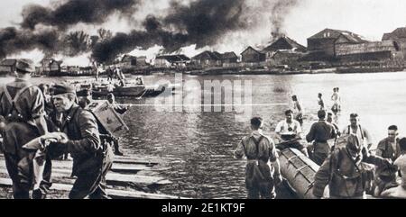 German troops on the East Front (1941). Everything was an obstacle to the Germans: the plain, the rivers, the destroyed bridges, the burning villages. Stock Photo