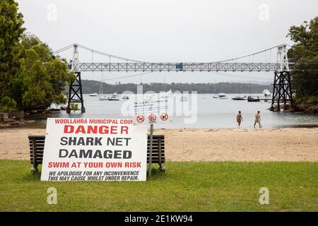 Woollahra Municipal Council ‘danger shark net damaged swim at your own risk’ sign at Parsley Bay Beach, Vaucluse, Sydney, NSW, Australia Stock Photo