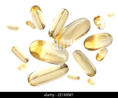 Yellow capsules levitate on a white background Stock Photo