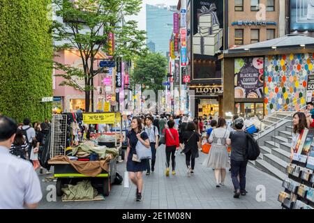 Street view of Myeongdong Shopping Street , mostly a commercial area, being one of Seoul's main shopping, parade route and tourism districts in Seoul, Stock Photo