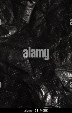 Black plastic bag texture, macro background, abstract pattern Stock Photo