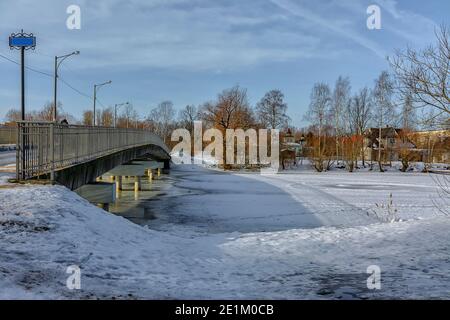 The Big Chukhonsky Bridge over the Izhora River in Kolpino in St. Petersburg. Stock Photo