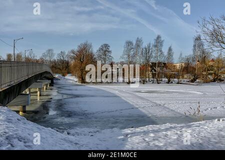 The Big Chukhonsky Bridge over the Izhora River in Kolpino in St. Petersburg. Stock Photo