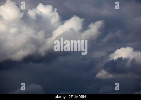 Dark cloudy sky. Overcast sky before rain. Large dark blue storm clouds Stock Photo