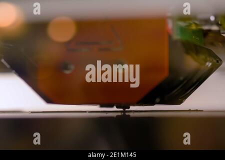 Three dimensional printing machine prints physical 3D model - close up Stock Photo