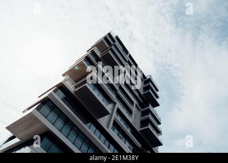 Berlin, Germany - July 29, 2019:Luxury residential skyscraper against sky. Concept rent control or regulation Stock Photo