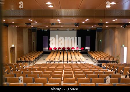 Empty conference room or amphitheatre with blurred background Stock Photo