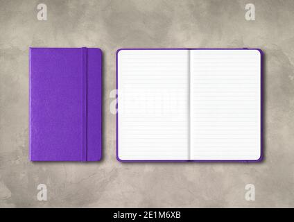 Purple closed and open lined notebooks mockup isolated on concrete background Stock Photo