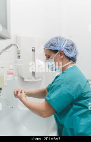 Surgeon or nurse washing hands before surgical intervention Stock Photo