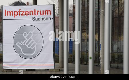 Dresden, Germany. 08th Jan, 2021. A banner with the inscription 'Vaccination Center Saxony' hangs in front of the Messe Dresden. The official start of the vaccination centres in Saxony begins on 11.01.2020. Credit: Robert Michael/dpa-Zentralbild/dpa/Alamy Live News Stock Photo