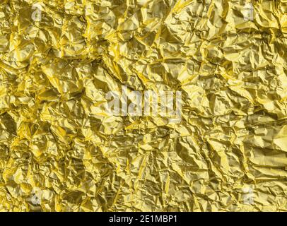 Crumpled textured aluminum foil background of illuminating color of the year 2021. Modern trendy surface for text message, mock up, art work design. F Stock Photo