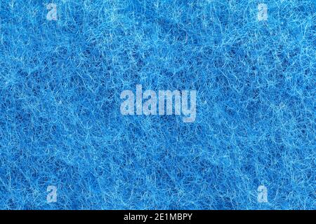 Blue felt texture. Full frame macro photography of wool fiber non-woven textile material. Abstract pattern background. Close-up design element. Stock Photo