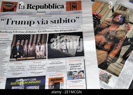 The authoritative Italian newspaper 'La Repubblca' on the front page headlines Trump away immediately. Assault on Congress, coup d'état. The photos of the clashes and of Jake Angeli known as the shaman. Stock Photo