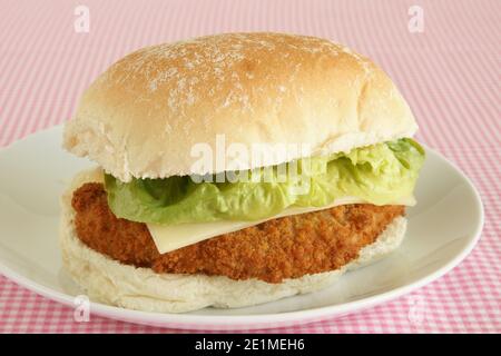 Chicken fillet in a bun with lettuce and cheese Stock Photo