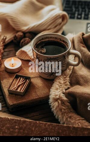 A cup of warm coffee on wooden table