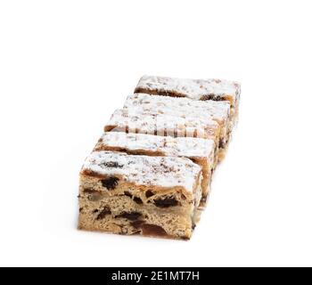 Christmas  stollen slices with icing sugar isolated on white Stock Photo