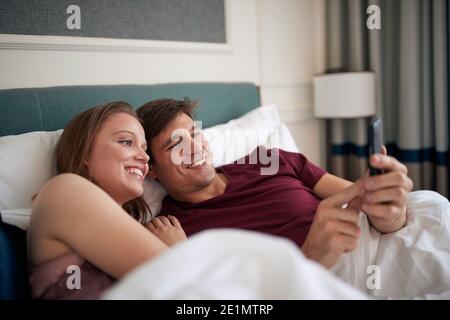 Happy couple on a valentine trip in a hotel Stock Photo